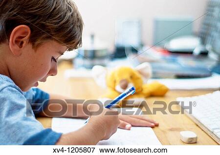 Boy studing at home View Large Photo Image Stock Photo - Boy studing at home. Fotosearch