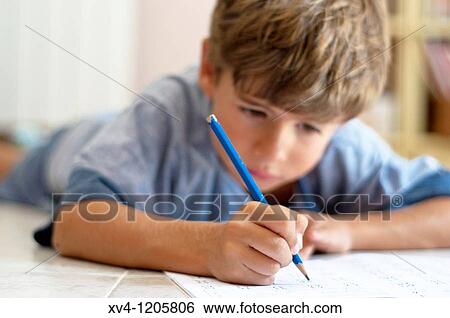 Boy studing at home View Large Photo Image Stock Photograph - Boy studing at home. Fotosearch