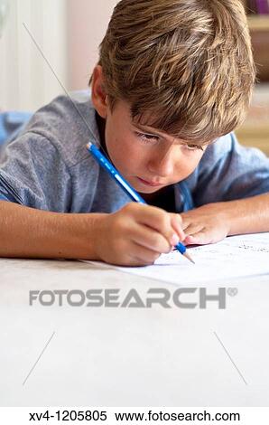 Boy studing at home View Large Photo Image Stock Photography - Boy studing at home. Fotosearch