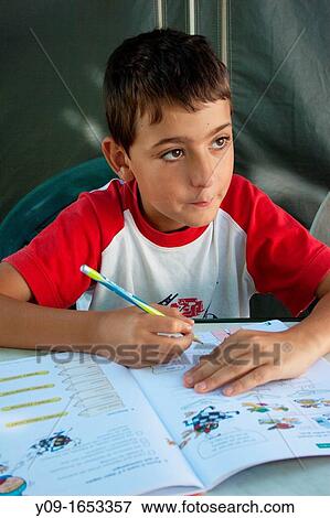 Boy studying View Large Photo Image Stock Photo - Boy studying. Fotosearch