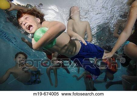 Boy swiming unnderwater with a ball View Large Photo Image Stock Photography - Boy swiming unnderwater with a ball. Fotosearch