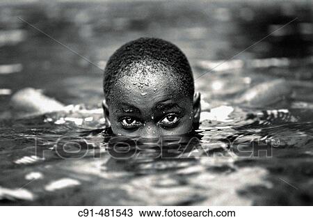 Boy swimming in Moshi, Tanzania View Large Photo Image Stock Image - Boy swimming in Moshi, Tanzania. Fotosearch
