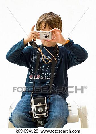 Boy taking pictures View Large Photo Image Stock Photo - Boy taking pictures. Fotosearch