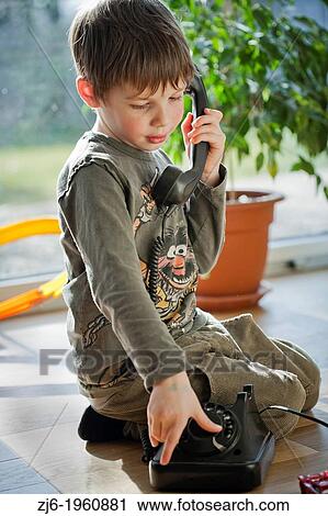 Boy using a retro telephone. View Large Photo Image Stock Image - Boy using a retro telephone.. Fotosearch