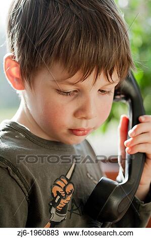 Boy using a retro telephone. View Large Photo Image Stock Image - Boy using a retro telephone.. Fotosearch