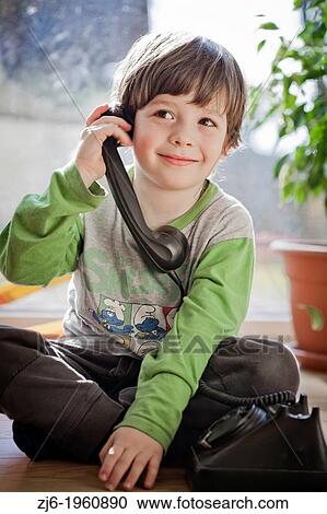 Boy using a retro telephone. View Large Photo Image Stock Image - Boy using a retro telephone.. Fotosearch