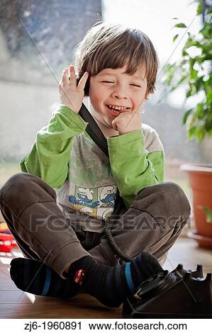 Boy using a retro telephone. View Large Photo Image Stock Image - Boy using a retro telephone.. Fotosearch