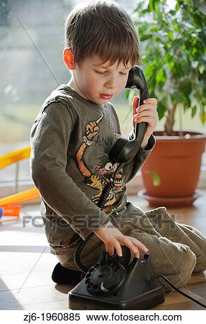 Boy using a retro telephone. View Large Photo Image Stock Photography - Boy using a retro telephone.. Fotosearch