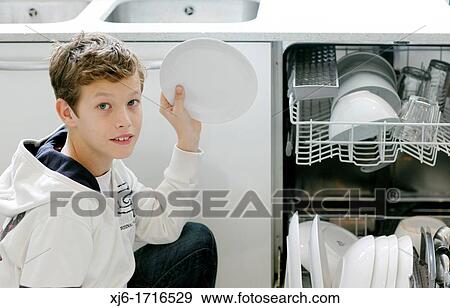 Boy using dishwasher View Large Photo Image Stock Photo - Boy using dishwasher. Fotosearch