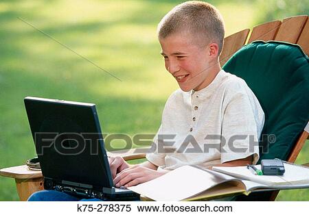 boy using laptop outdoors View Large Photo Image Stock Photography - boy using laptop outdoors. Fotosearch