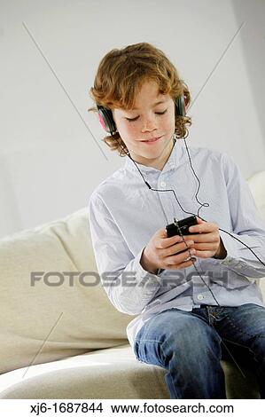 Boy using smartphone View Large Photo Image Picture - Boy using smartphone. Fotosearch