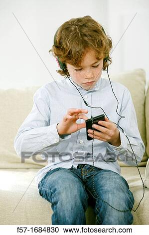 Boy using smartphone View Large Photo Image Stock Image - Boy using smartphone. Fotosearch