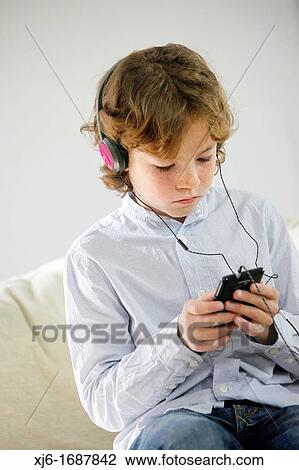 Boy using smartphone View Large Photo Image Stock Image - Boy using smartphone. Fotosearch