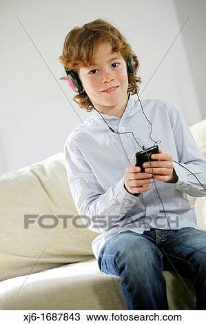 Boy using smartphone View Large Photo Image Stock Image - Boy using smartphone. Fotosearch
