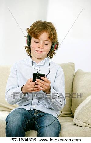 Boy using smartphone View Large Photo Image Stock Photograph - Boy using smartphone. Fotosearch