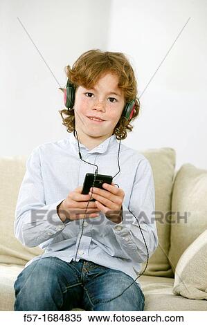 Boy using smartphone View Large Photo Image Stock Photography - Boy using smartphone. Fotosearch