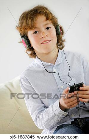 Stock Photography - Boy using smartphone. Fotosearch