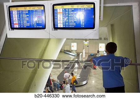 Boy waiting by flight information boards in the Bilbao airport by Santiago Calatrava, Loiu. Biscay, Euskadi. Spain View Large Photo Image Stock Image - Boy waiting by flight information boards in the Bilbao airport by Santiago Calatrava, Loiu. Biscay, Euskadi. Spain. Fotosearch