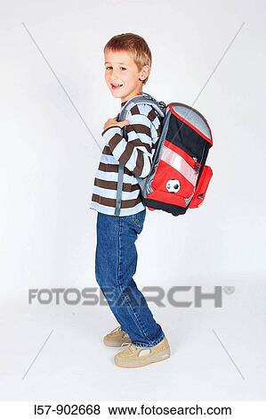 boy walking with satchel, white background, Studio, Switzerland View Large Photo Image Stock Photo - boy walking with satchel, white background, Studio, Switzerland. Fotosearch