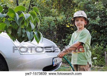 Stock Photo - Boy washing a car. Fotosearch
