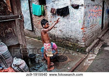 Boy washing himself in the street Calcutta, Kolkata, West Bengal, India View Large Photo Image Stock Image - Boy washing himself in the street Calcutta, Kolkata, West Bengal, India. Fotosearch