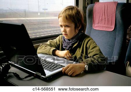 Boy watching film in laptop computer, tran View Large Photo Image Stock Image - Boy watching film in laptop computer, tran. Fotosearch