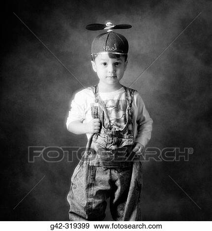 Boy wearing propellor beanie cap View Large Photo Image Stock Photo - Boy wearing propellor beanie cap. Fotosearch