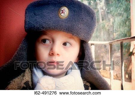 Stock Photograph - Boy with a cap.. Fotosearch