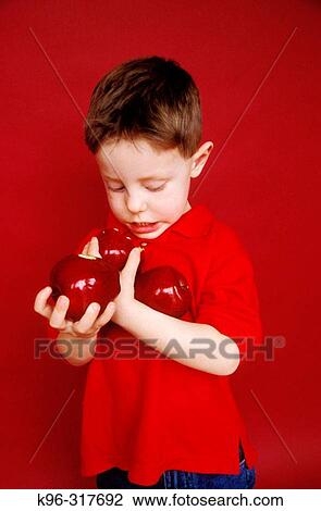 Stock Image - Boy With Apples. Fotosearch