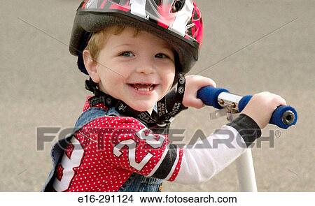 Boy with bike helmet and scooter View Large Photo Image Picture - Boy with bike helmet and scooter. Fotosearch
