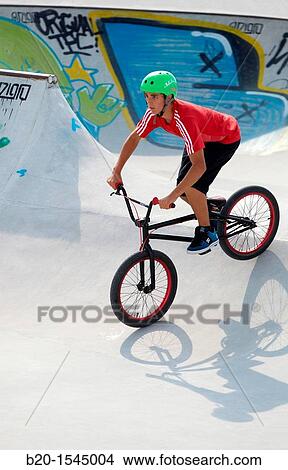 Boy with BMX Bike in Skate park, Irun, Gipuzkoa, Euskadi, Spain View Large Photo Image Picture - Boy with BMX Bike in Skate park, Irun, Gipuzkoa, Euskadi, Spain. Fotosearch