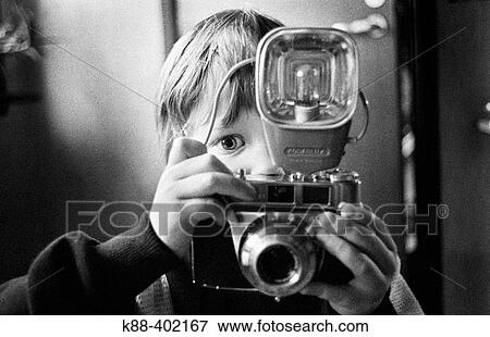 Stock Photo - Boy with camera, Sweden. Fotosearch