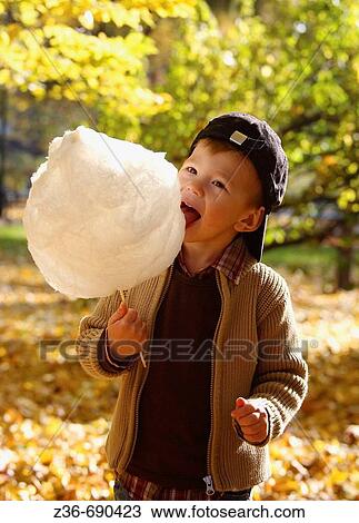 Boy with candy floss View Large Photo Image Stock Image - Boy with candy floss. Fotosearch