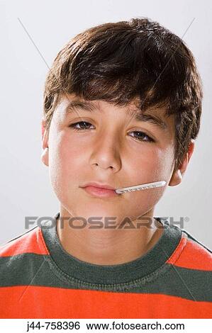 Boy with celsius thermometer in mouth, Studio, Portrait View Large Photo Image Stock Photograph - Boy with celsius thermometer in mouth, Studio, Portrait. Fotosearch