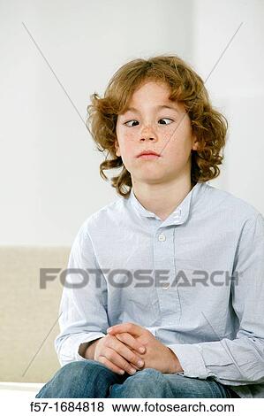 Boy with crossed eyes View Large Photo Image Stock Photo - Boy with crossed eyes. Fotosearch