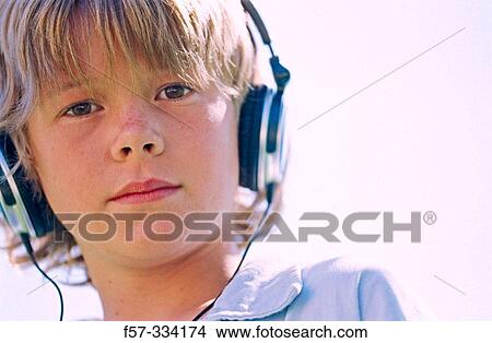 Boy with headphones View Large Photo Image Picture - Boy with headphones. Fotosearch