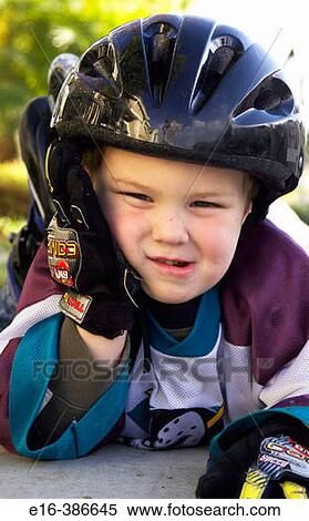 Stock Photography - boy with helmet on. Fotosearch