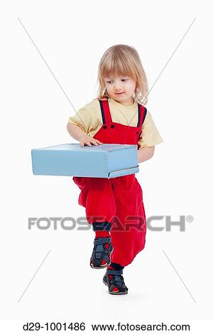 Stock Photograph - boy with long blond hair and suitcase isolated on white. Fotosearch