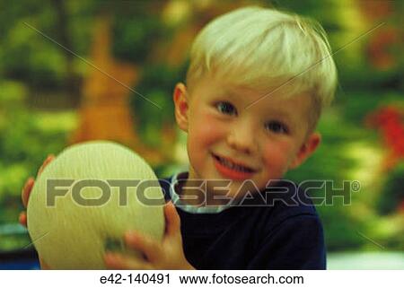 Boy with melon View Large Photo Image Stock Image - Boy with melon. Fotosearch