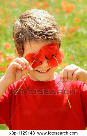 Stock Image - Boy with poppies. Fotosearch