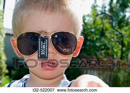 Boy with sunglasses View Large Photo Image Stock Photo - Boy with sunglasses. Fotosearch
