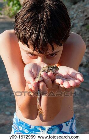 Boy with toad View Large Photo Image Stock Photo - Boy with toad. Fotosearch