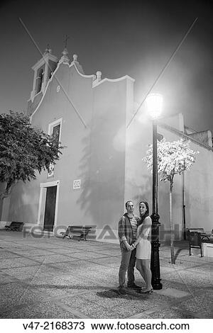 Boyfriends couple holding hands in front of the church View Large Photo Image Stock Image - Boyfriends couple holding hands in front of the church. Fotosearch