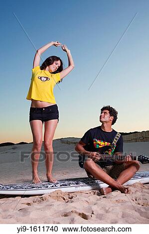 boyfriends singing and dancing with guitar View Large Photo Image Stock Image - boyfriends singing and dancing with guitar. Fotosearch