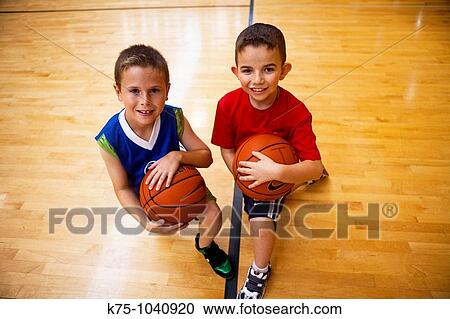 Stock Image - boys and basketball portrait. Fotosearch