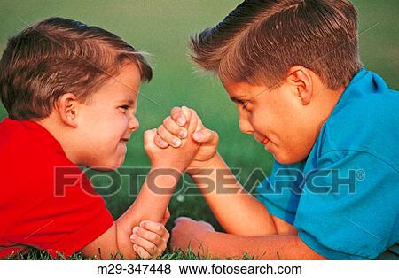 Boys arm wrestling View Large Photo Image Stock Photo - Boys arm wrestling. Fotosearch