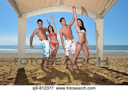Boys dancing on the beach. View Large Photo Image Stock Photo - Boys dancing on the beach.. Fotosearch