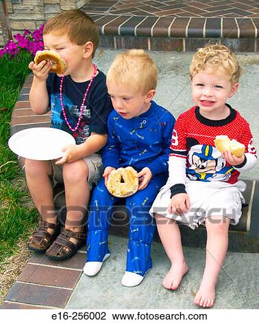 Boys eating bagels View Large Photo Image Stock Image - Boys eating bagels. Fotosearch