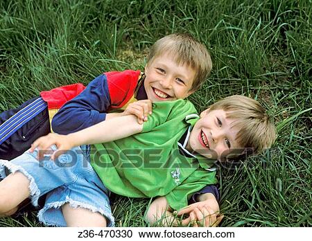 Boys fighting playfully View Large Photo Image Stock Image - Boys fighting playfully. Fotosearch