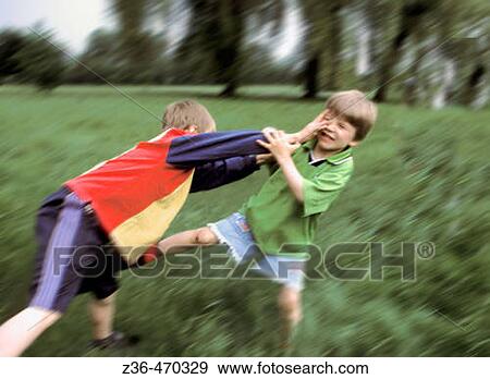 Boys fighting playfully View Large Photo Image Stock Photo - Boys fighting playfully. Fotosearch